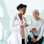 a photo of a doctor speaking with their patient